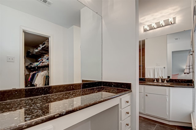 bathroom with vanity and tile patterned floors