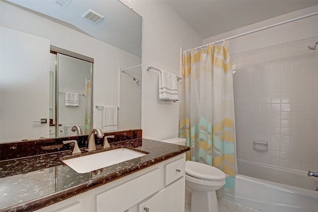 full bathroom featuring vanity, toilet, shower / bath combo with shower curtain, and tile patterned flooring