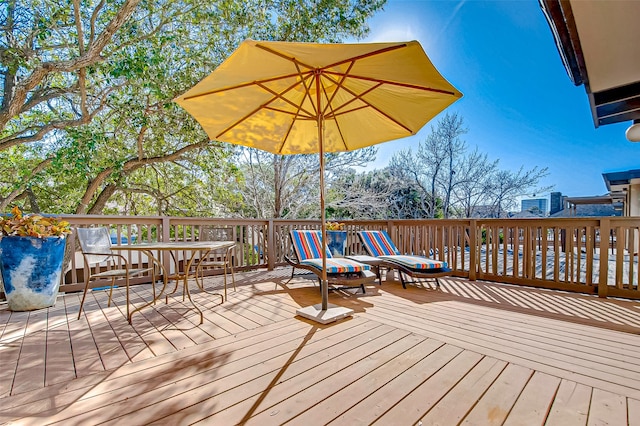 wooden terrace with a fire pit