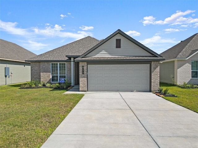 ranch-style home featuring a garage and a front yard