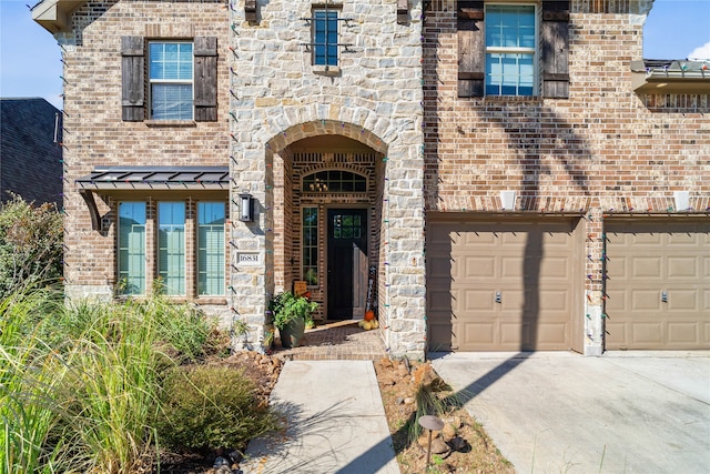 view of exterior entry featuring a garage