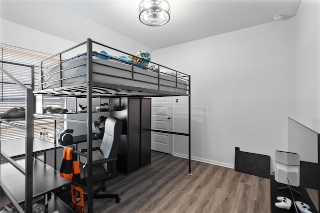 bedroom with hardwood / wood-style floors