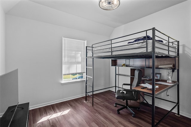 bedroom with wood-type flooring and lofted ceiling