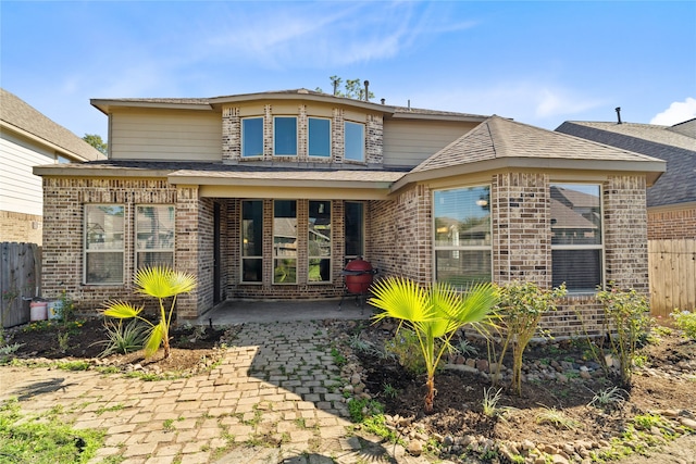 rear view of house featuring a patio area