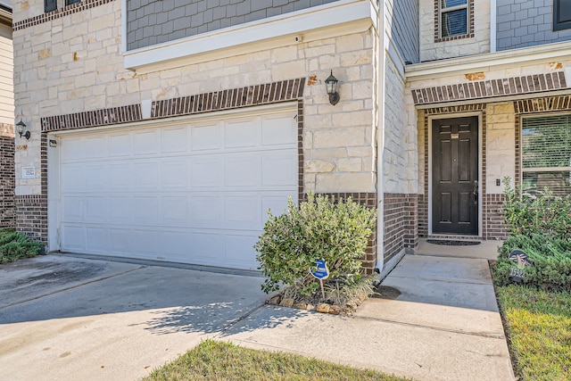 view of exterior entry featuring a garage