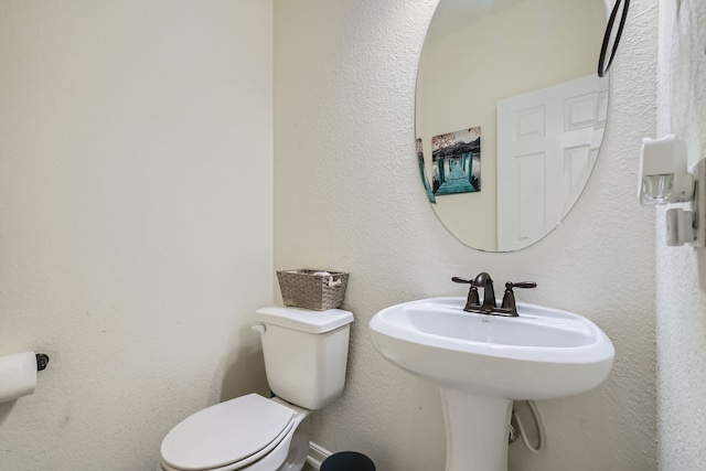 bathroom with sink and toilet