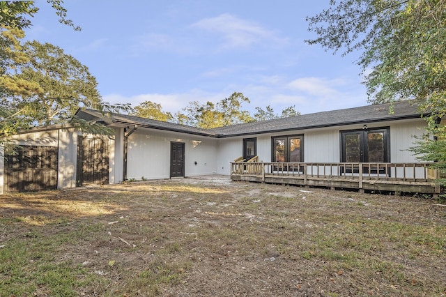 single story home with a wooden deck