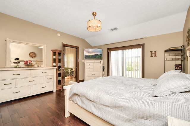 bedroom with dark hardwood / wood-style floors and vaulted ceiling