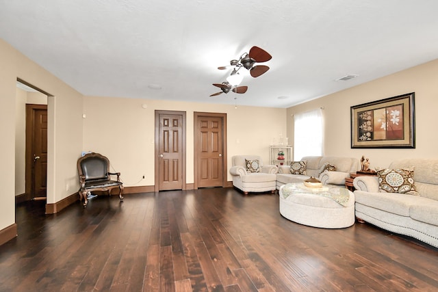 living room with ceiling fan and dark hardwood / wood-style flooring