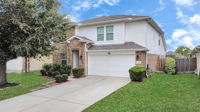 front of property with a front lawn and a garage