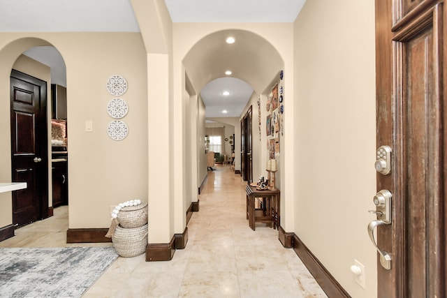 corridor featuring light tile patterned floors