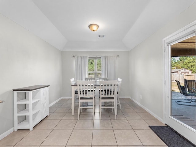 unfurnished dining area with light tile patterned floors