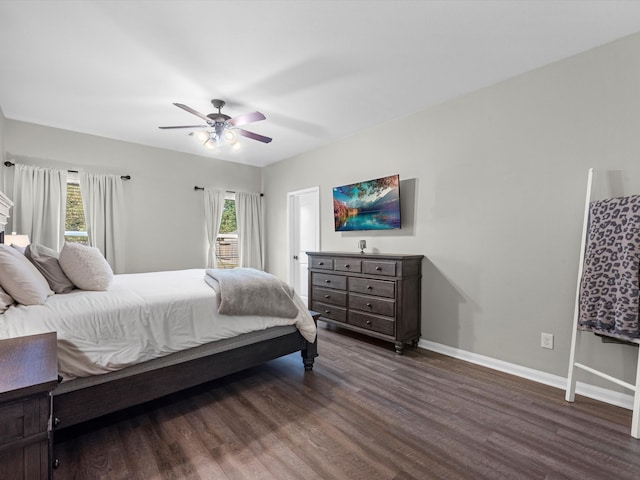 bedroom with dark wood-type flooring and ceiling fan