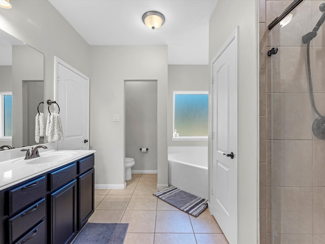 full bathroom with toilet, shower with separate bathtub, vanity, and tile patterned floors