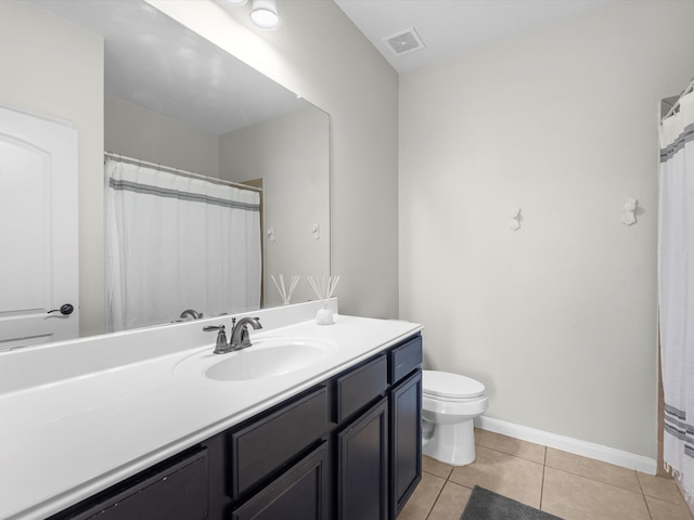 bathroom featuring toilet, a shower with curtain, vanity, and tile patterned flooring