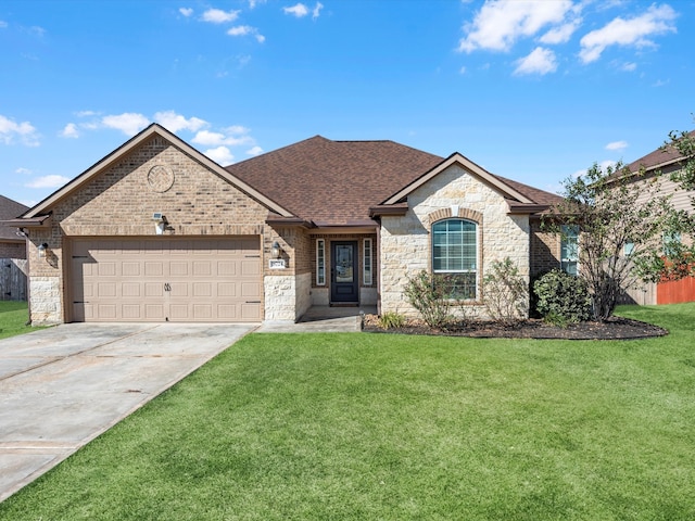 view of front of home with a front yard and a garage