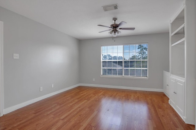 unfurnished room featuring light hardwood / wood-style floors and ceiling fan