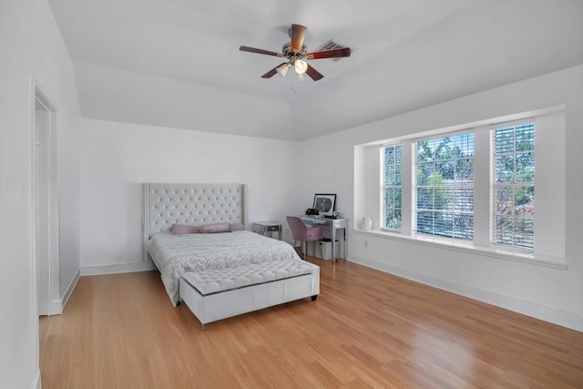 bedroom with ceiling fan and light hardwood / wood-style floors