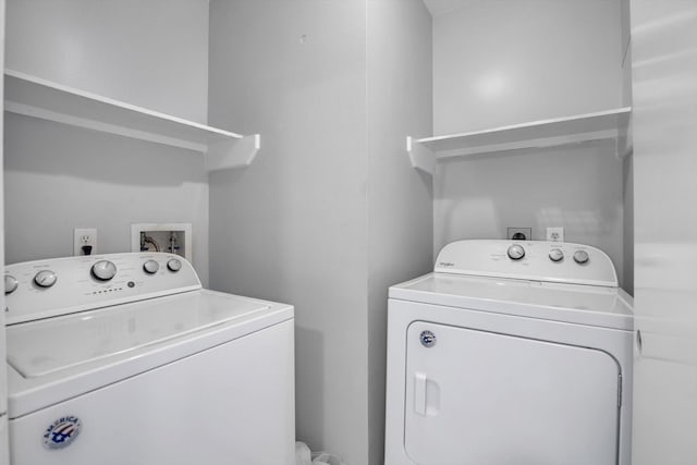 clothes washing area featuring washing machine and clothes dryer