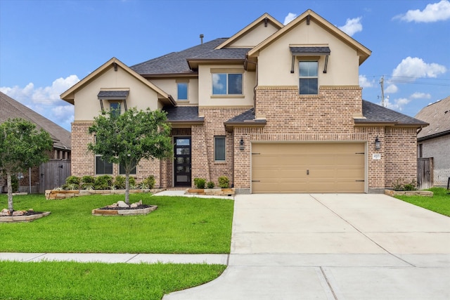 view of front of home with a front yard and a garage