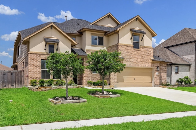 view of front of house with a front yard and a garage