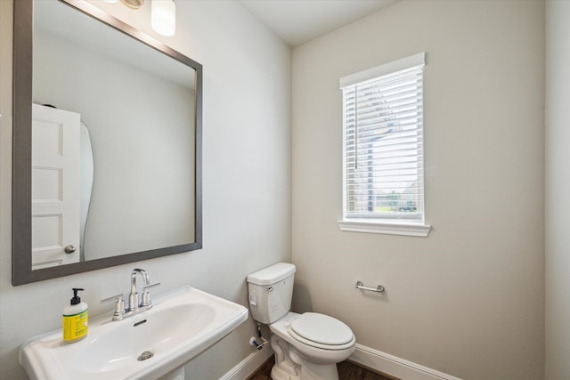 bathroom featuring toilet and sink