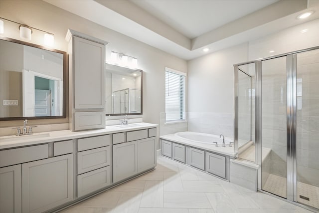 bathroom featuring vanity and plus walk in shower