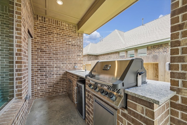 view of patio / terrace featuring exterior kitchen and area for grilling