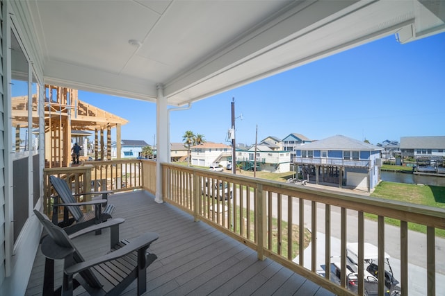 wooden terrace with a water view