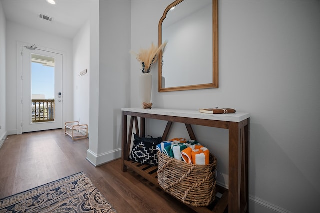 entryway with dark hardwood / wood-style floors