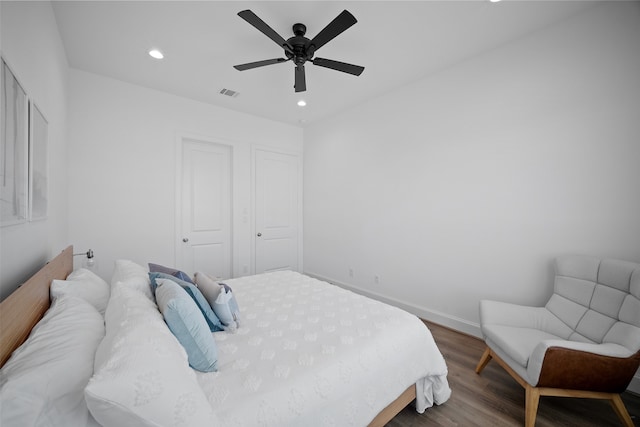 bedroom featuring ceiling fan and hardwood / wood-style flooring