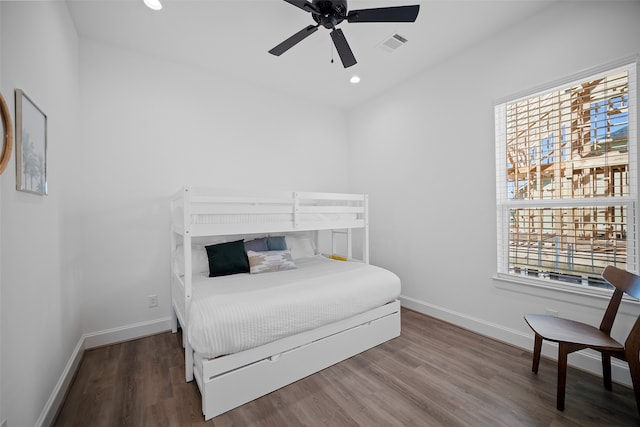 bedroom with ceiling fan and hardwood / wood-style flooring