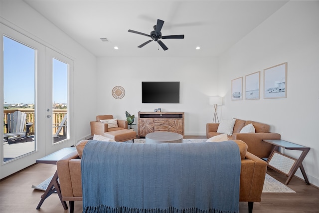 living room with french doors, wood-type flooring, and ceiling fan