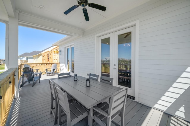 22831 Cuadro St, Galveston, TX 77554 - wooden terrace featuring french doors, a ceiling fan, and outdoor dining space