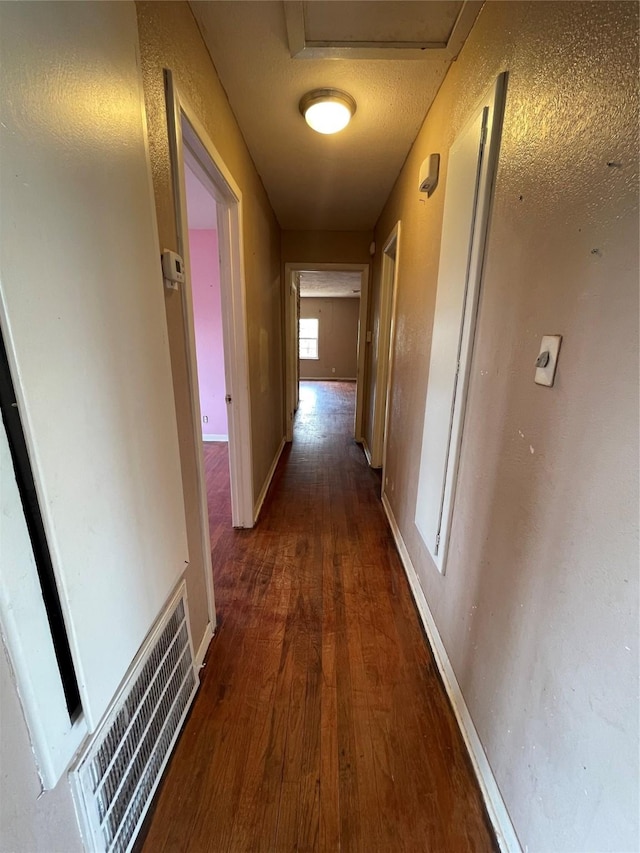 hall with dark hardwood / wood-style flooring