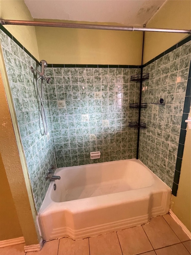 bathroom featuring tile patterned floors and tiled shower / bath combo