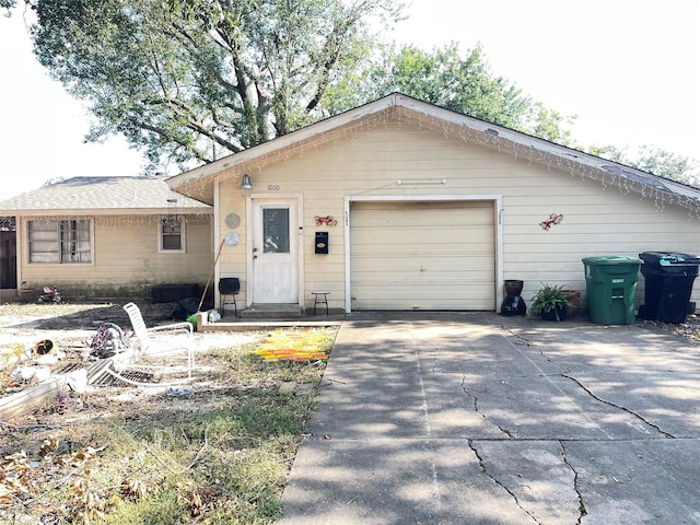 ranch-style house featuring a garage