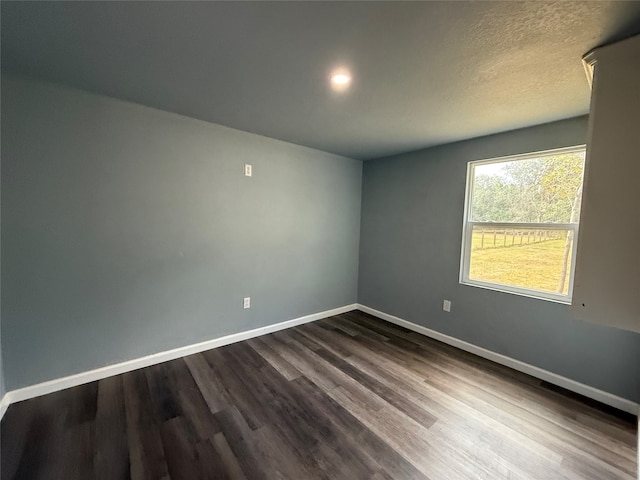 empty room featuring hardwood / wood-style floors