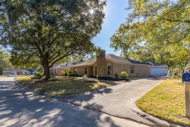 single story home with a front lawn and a garage