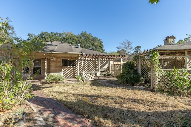 back of house featuring a pergola