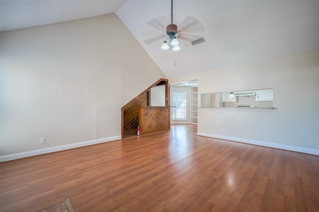 unfurnished living room with light hardwood / wood-style flooring, high vaulted ceiling, and ceiling fan