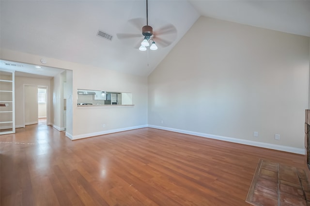 unfurnished living room featuring hardwood / wood-style flooring, high vaulted ceiling, and ceiling fan