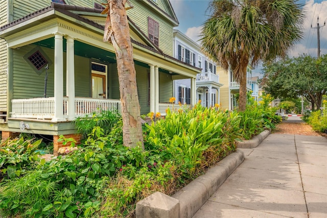 view of property exterior with covered porch