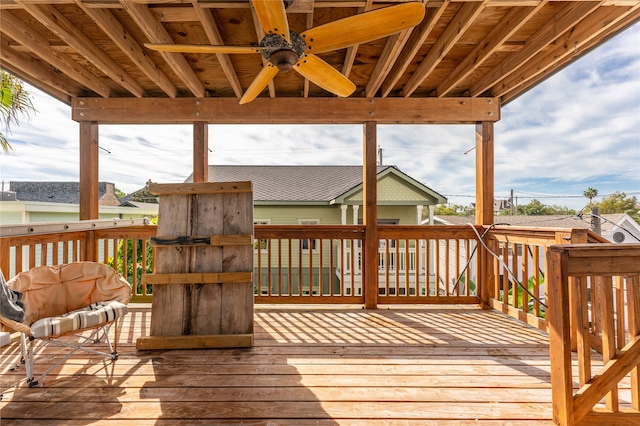 wooden terrace featuring ceiling fan