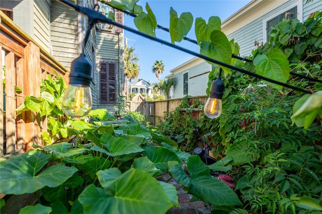 view of home's exterior featuring fence