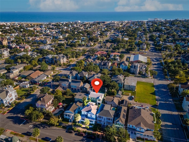 drone / aerial view with a water view and a residential view