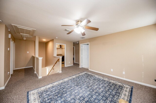 4609 Buescher Ct, Pearland, TX 77584 - carpeted empty room featuring baseboards, visible vents, attic access, and a ceiling fan