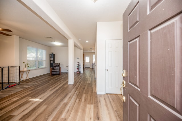 entryway featuring light wood-type flooring and ceiling fan