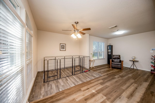 4609 Buescher Ct, Pearland, TX 77584 - interior space featuring wood finished floors, ceiling fan, visible vents, and baseboards