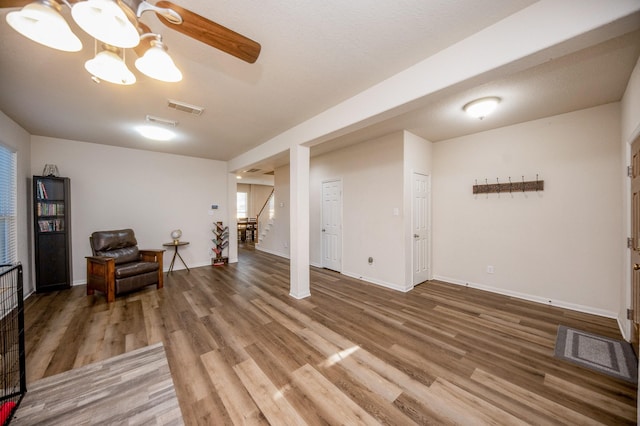 4609 Buescher Ct, Pearland, TX 77584 - basement with baseboards, visible vents, stairs, and light wood finished floors
